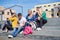 Students outside sitting on steps