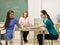 Students passing notes in classroom