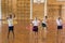 Students playing with hula hoop in school gym