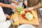 Students prepare pasta and salad in the kitchen