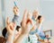 Students raising hands in class