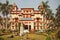 Students relaxing near the building of Bannares Hindu University with green area