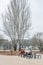 Students taking a pause eating at the steel outdoor furniture table in the