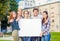 Students or teenagers with white blank board