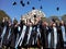 Students throwing graduation hats