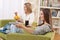 Students - Two female teenager watching television