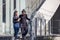 Students walk the stairways on campus, a couple walking down into the ground for extra education