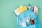 Studies during quarantine concept. Top above overhead view photo of backpack filled with colorful stationery two blue masks soap