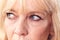 Studio Close Up Of Mature Woman Looking Suspicious And Distrustful