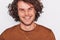 Studio closeup cropped portrait of handsome positive male with healthy toothy smile, posing for advertisement