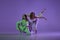 Studio footage of dancing young girls. Stylish performance. Two young women in expressive contemporary dance 