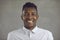 Studio headshot of a happy friendly young African-American man smiling at the camera