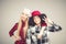 Studio lifestyle portrait of two best friends hipster girls going crazy and having great time together. on