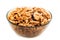 Studio photo of bowl with heap of peeled walnuts isolated on white