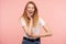 Studio photo of excited young lovely redhead woman looking at camera with wide eyes and mouth opened and holding raised palm on