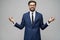 Studio photo of meditative young handsome stylish businessman wearing suit