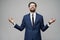 Studio photo of meditative young handsome stylish businessman wearing suit