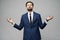 Studio photo of meditative young handsome stylish businessman wearing suit