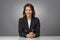 Studio portrait of attractive brunette haired businesswoman posing at isolated background