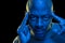 Studio portrait of a black man with concentration expression. Blue light