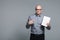 Studio portrait of business trainer holding the white book