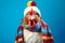 Studio portrait of a chicken or hen wearing knitted hat, scarf and mittens. Colorful winter and cold weather concept