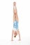 Studio Portrait Of Female Gymnast Doing Handstand