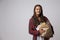 Studio Portrait Of Female Nutritionist With Bag Of Food