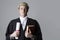 Studio Portrait Of Lawyer Holding Brief And Book