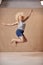 Studio Portrait Shot Of Body Positive Albino Woman Jumping In The Air