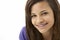 Studio Portrait of Smiling Teenage Girl