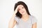 Studio Portrait Of Stressed Woman Against White Background