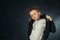 Studio portrait of a stylish boy in a leather jacket . Little rocker