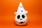 Studio portrait of white halloween pumpkin on background of lush lava color.