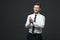 Studio portrait of young happy handsome businessman claping hand