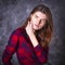 Studio portrait of young longhaired beautiful woman.