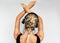 Studio rear view image of relaxing beautiful blonde young woman dancing during listening to music in headphones. Pretty female in