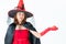 Studio shot Asian woman in red costume witch open left hand hold