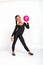 Studio shot of attractive little gymnast girl of mulatto with long braid of frizzy wearing black legends and a bathing suit