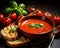 studio shot basil with spicy tomato soup