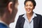 Studio Shot Of Businesswoman Interviewing Businessman For Employment Against White Background