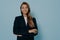 Studio shot of determined beautiful businesswoman in formal black suit