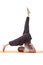 Studio shot of flexible athletic man doing yoga