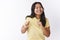 Studio shot of funny and enthusiastic upbeat joyful female in yellow t-shirt making dance moves shaking body and hands