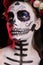 Studio shot of glamorous woman with skull make up