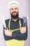 Studio shot of a happy bearded young man holding sharp knives