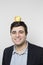 Studio shot of happy person with an apple on his head