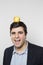 Studio shot of happy person with an apple on his head