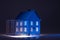 Studio shot of illuminated blue house