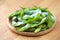 studio shot of Japanese style boiled beans EDAMAME on basket bamboo wooden..